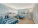 Guest bedroom with twin beds and light blue walls at 8779 Midnight Pass Rd # 504H, Sarasota, FL 34242