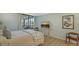 Comfortable bedroom with a TV and access to a balcony at 8779 Midnight Pass Rd # 504H, Sarasota, FL 34242