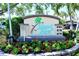 Island Reef building sign with monthly rental information at 8779 Midnight Pass Rd # 504H, Sarasota, FL 34242