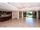 Spacious community room with kitchen and sliding doors to a pool area at 8779 Midnight Pass Rd # 504H, Sarasota, FL 34242