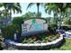 Attractive community entrance sign with landscaping at 8779 Midnight Pass Rd # 504H, Sarasota, FL 34242