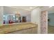 Kitchen views from the dining area with stylish wallpaper at 8779 Midnight Pass Rd # 504H, Sarasota, FL 34242