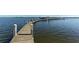 Long wooden walkway leading to a waterfront dock at 8779 Midnight Pass Rd # 504H, Sarasota, FL 34242