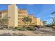 Condo building with parking and landscaping at 8779 Midnight Pass Rd # 504H, Sarasota, FL 34242