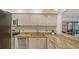Updated kitchen with granite countertops and stainless steel appliances at 8779 Midnight Pass Rd # 504H, Sarasota, FL 34242