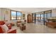 Bright living room with hardwood floors and access to balcony at 8779 Midnight Pass Rd # 504H, Sarasota, FL 34242