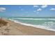 Expansive sandy beach with gentle waves, ideal for relaxation at 8779 Midnight Pass Rd # 504H, Sarasota, FL 34242