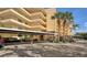 Covered parking with paved surface and landscaping at 8779 Midnight Pass Rd # 504H, Sarasota, FL 34242
