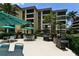 Community patio with grills and seating areas at 8779 Midnight Pass Rd # 504H, Sarasota, FL 34242