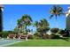 Landscaped area with benches near the pool and shuffleboard at 8779 Midnight Pass Rd # 504H, Sarasota, FL 34242