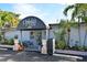 Ophelia's on the Bay restaurant with awning and outdoor seating at 8779 Midnight Pass Rd # 504H, Sarasota, FL 34242