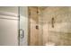 Clean shower with glass enclosure and tiled walls at 8779 Midnight Pass Rd # 504H, Sarasota, FL 34242