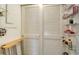 White built-in shelving and a drying rack in this storage area at 8779 Midnight Pass Rd # 504H, Sarasota, FL 34242