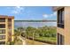 Stunning water view from condo with lush landscaping and walkway at 8779 Midnight Pass Rd # 504H, Sarasota, FL 34242