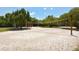 Outdoor sand volleyball court with net at 8779 Midnight Pass Rd # 504H, Sarasota, FL 34242