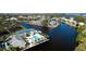 Home's location on a waterfront lot with mature trees at 11013 Jasmine Cir, Bradenton, FL 34209