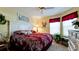 King-size bed in a well-lit bedroom at 11013 Jasmine Cir, Bradenton, FL 34209