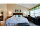 Spacious bedroom with a king-size bed and en-suite bathroom at 11013 Jasmine Cir, Bradenton, FL 34209