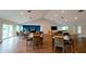 Community room with tables, chairs, and TV at 11013 Jasmine Cir, Bradenton, FL 34209