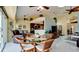 Bright dining area with a glass-top table and kitchen access at 11013 Jasmine Cir, Bradenton, FL 34209