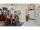 Bright dining area showcasing a formal wood table and entryway at 11013 Jasmine Cir, Bradenton, FL 34209