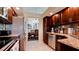 Modern kitchen with stainless steel appliances and granite countertops at 11013 Jasmine Cir, Bradenton, FL 34209