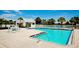 Community pool with ample deck space and seating at 11013 Jasmine Cir, Bradenton, FL 34209