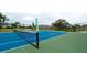 Well-maintained tennis court with blue and green surface at 11013 Jasmine Cir, Bradenton, FL 34209