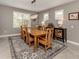 Bright dining room featuring a wood table and neutral color palette at 19696 Petrino St, Venice, FL 34293