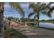 Brick footbridge over water with lush landscaping at 19696 Petrino St, Venice, FL 34293