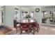 Charming breakfast nook with a round table and bay window at 2115 Lychee Ln, Nokomis, FL 34275