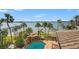 Relaxing pool area with a waterfall feature and breathtaking water views at 2115 Lychee Ln, Nokomis, FL 34275