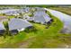 Aerial view of houses and community with a canal at 226 Van Gogh Cv, Bradenton, FL 34212