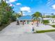 Cute cottage with turquoise accents and white picket fence at 229 Shore T Rd, Nokomis, FL 34275