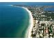 Aerial view showcasing the beach and neighborhood at 2310 Gulf N Dr # 205, Bradenton Beach, FL 34217