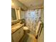 Clean bathroom with granite vanity and shower/tub combo at 2310 Gulf N Dr # 205, Bradenton Beach, FL 34217
