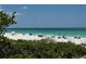 Stunning view of a pristine beach with clear water at 2310 Gulf N Dr # 205, Bradenton Beach, FL 34217
