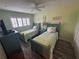 Guest bedroom with two twin beds at 2310 Gulf N Dr # 205, Bradenton Beach, FL 34217