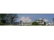 Beachfront property showcasing two buildings with balconies and beach access at 2310 Gulf N Dr # 205, Bradenton Beach, FL 34217