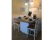 Bright kitchen features a granite island with seating for four at 2310 Gulf N Dr # 205, Bradenton Beach, FL 34217