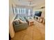 Beachy living room featuring a sectional sofa and coastal decor at 2310 Gulf N Dr # 205, Bradenton Beach, FL 34217
