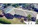 Ranch-style home with pool and screened enclosure, nicely landscaped yard at 2426 Nassau St, Sarasota, FL 34231