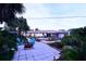 Large backyard patio with fire pit and garden at 2426 Nassau St, Sarasota, FL 34231