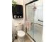 Modern bathroom with updated shower, toilet and vanity at 2426 Nassau St, Sarasota, FL 34231