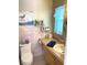 Updated bathroom with new vanity, toilet, and shower at 2426 Nassau St, Sarasota, FL 34231