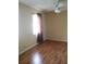 Bright bedroom with wood-look flooring and window coverings at 2426 Nassau St, Sarasota, FL 34231