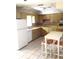 Bright kitchen features ample cabinetry and a small breakfast table at 2426 Nassau St, Sarasota, FL 34231