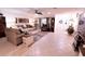 Bright living room features tile floors, comfy seating, and large windows at 2426 Nassau St, Sarasota, FL 34231