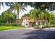 Gated community entrance with guardhouse and landscaping at 359 Turtleback Xing, Venice, FL 34292