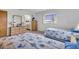 Bedroom with two twin beds, dresser, and ensuite bathroom at 430 Botticelli Dr # 430, Nokomis, FL 34275